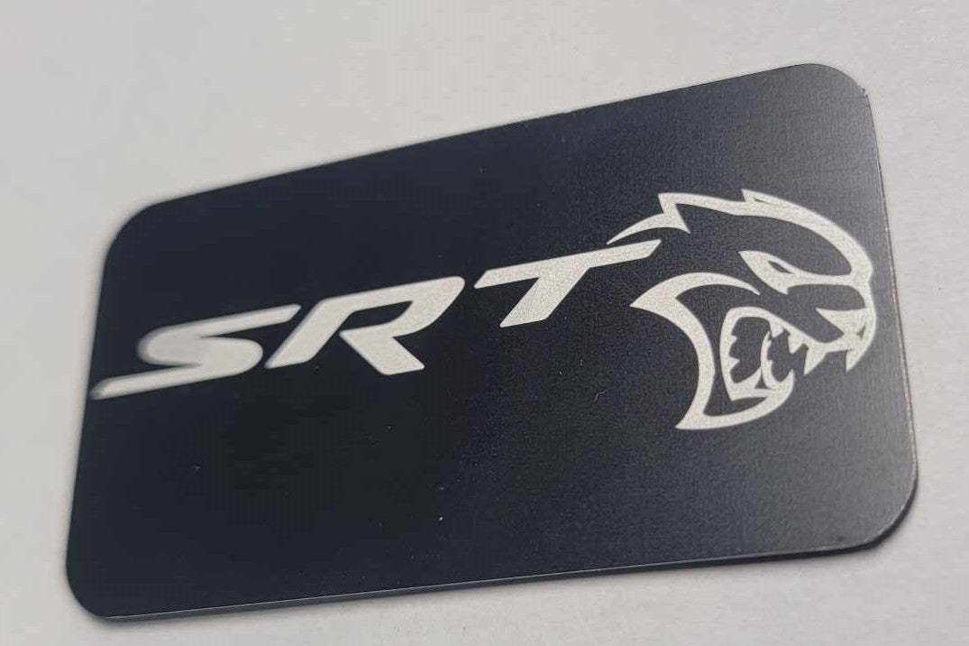Laser‑engraved black anodized Hellcat supercharger lid badge